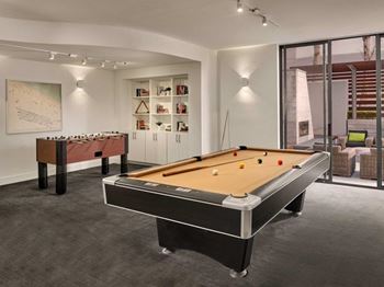 a game room with a pool table and a billiards